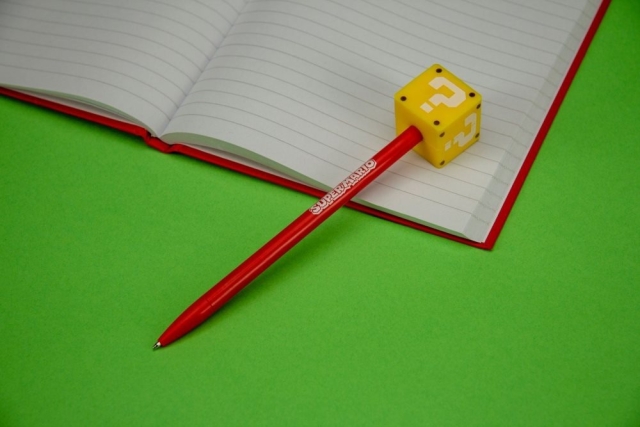Ink pen with question mark pad