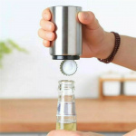 Automatic cap opener with magnet