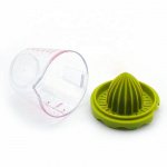 Citrus press in plastic, green.